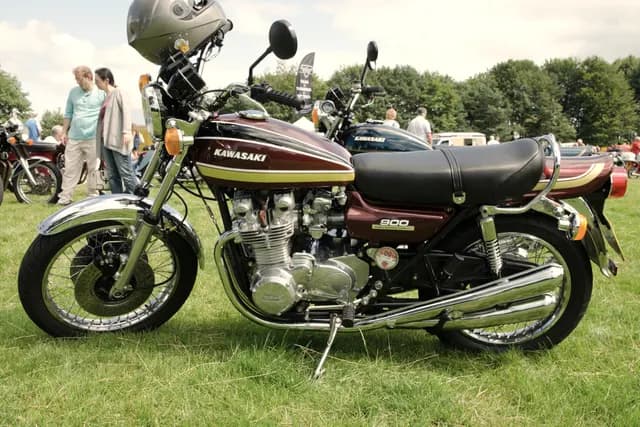 A 1975 Kawasaki Z1 900 parked on grass at a classic bike show